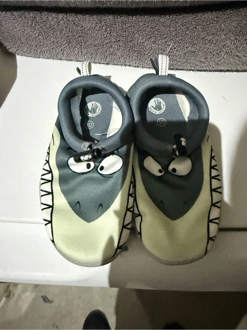 Body Glove kid's water shoes featuring a fun shark face